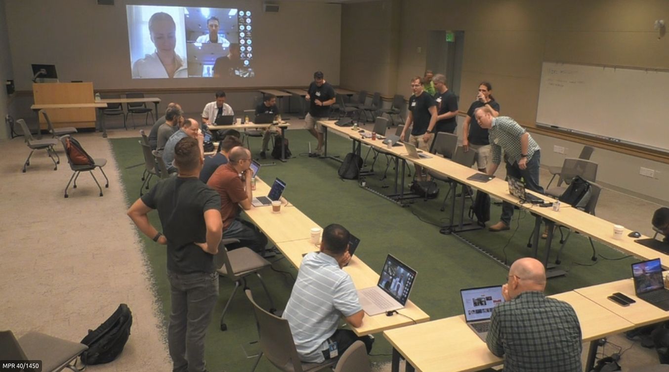 Overview of the meeting room, with the remote-attending participants